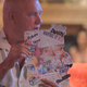 Dennis Hof presents one of the workers’ vision board at a weekly Tea Party at Bunny Ranch.